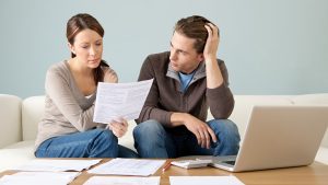 couple going through bad debts after the death of a family member and wondering if the bad debt can be inherited to them